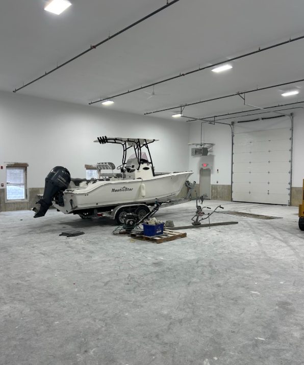 Interior flex unit at 85 Ledge Road with a boat in storage