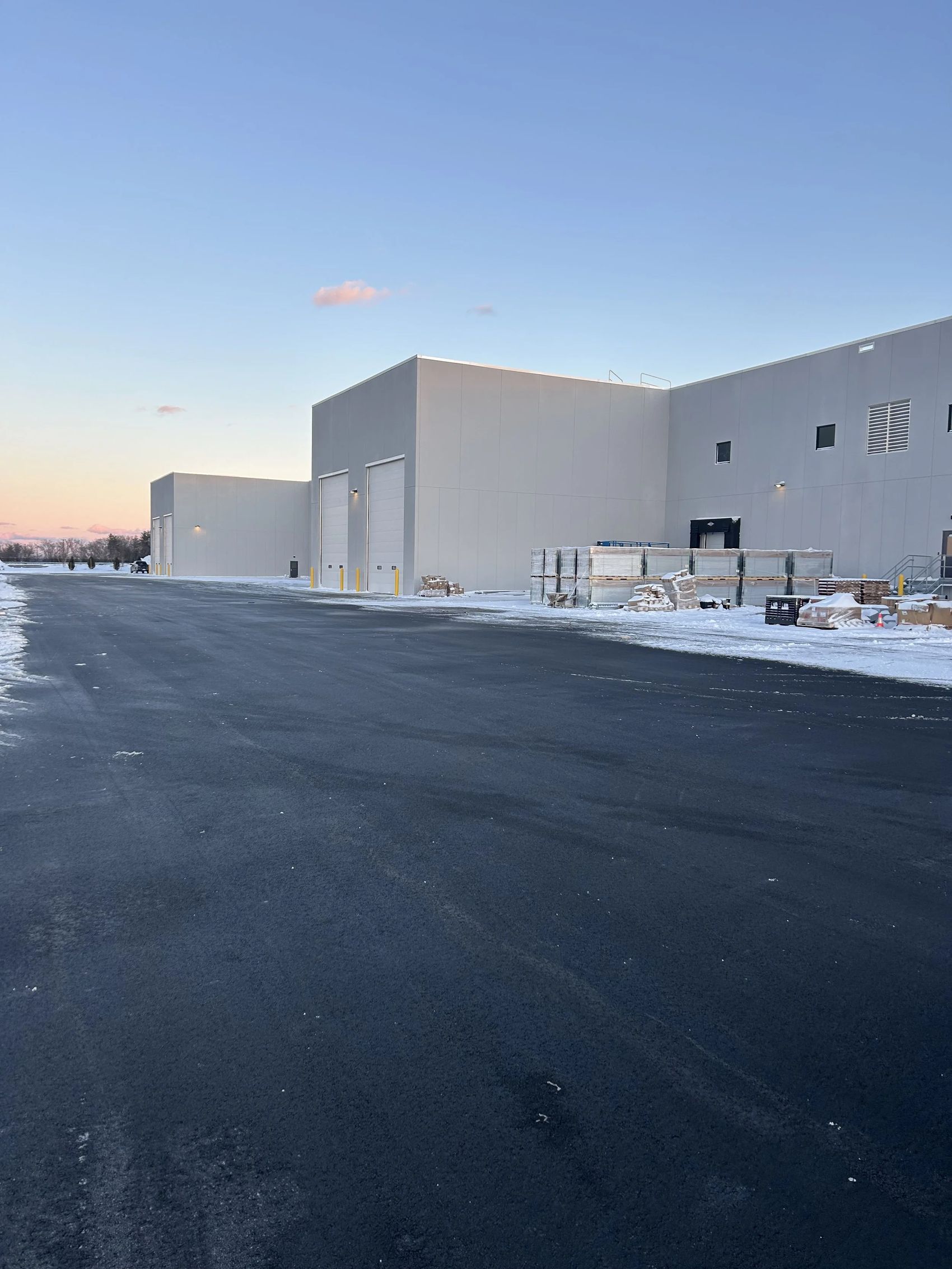 The 432,000 square foot Munters North American headquarters at 14 South Hunt Road, Amesbury, Massachusetts at dusk